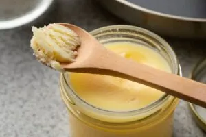 spoon with yellow vegetable ghee